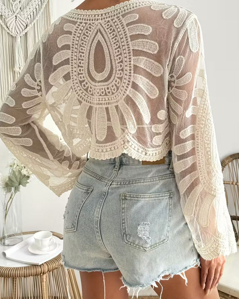 Copricostume velato con ricami floreali